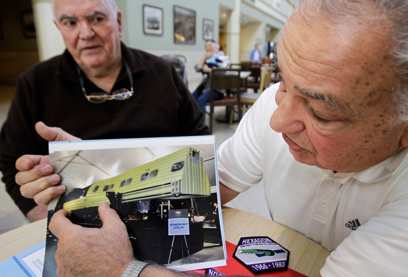 Two former NRO employees Fred Marra, left, and Bob Zarba describe the camera operation of the Hexagon KH-9 secret spy satellite, which was launched using the space shuttle, in a file photo from when the program was declassified in December 2011 (AP Photo/Kathy Willens)